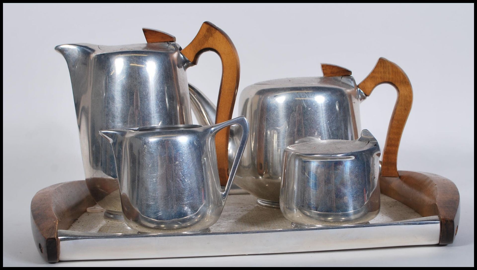 A vintage retro mid 20th Century five piece stainless steel Piquet Ware coffee service consisting of