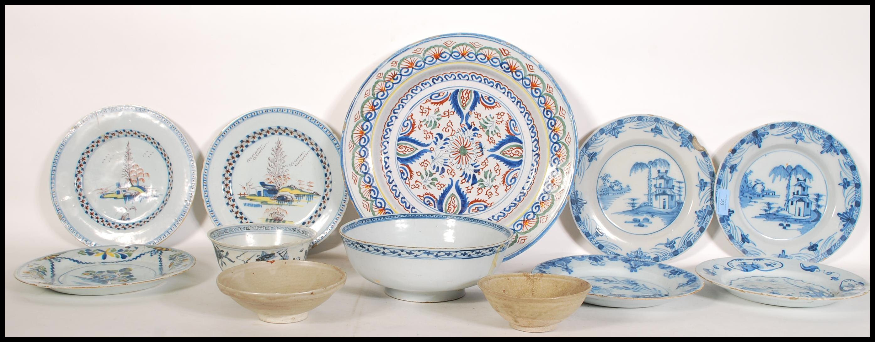 A collection of 18th century and 19th century Delft to include an 18th century blue and white dragon