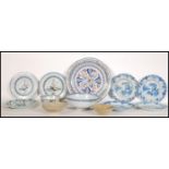 A collection of 18th century and 19th century Delft to include an 18th century blue and white dragon