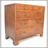 A Georgian late 18th Century oak chest of two short over three long drawers having crossbanded