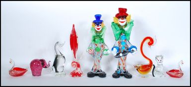 A pair of mid century Italian Murano studio art glass figurines of clowns in multiple tutti-frutti