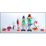 A pair of mid century Italian Murano studio art glass figurines of clowns in multiple tutti-frutti