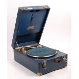 A vintage 20th Century Selecta portable picnic gramophone, in a blue leatherette carry case, turning