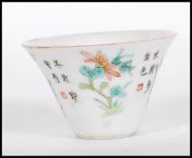 A 19th Century Chinese ' month cup / bowl ' being hand painted with different flowers of the month