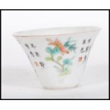 A 19th Century Chinese ' month cup / bowl ' being hand painted with different flowers of the month