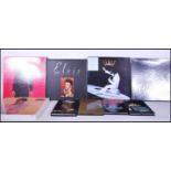 A collection of Elvis Presley collector music box sets on compact discs / CD. The sets to include