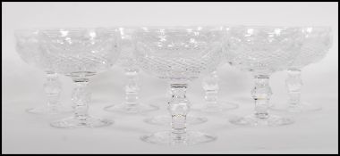 A set of eight 20th century Irish Waterford Crystal champagne glasses. Facet cut stems with deep cut