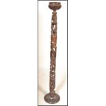 A 20th Century African tribal carved hardwood totem, the carved totem made from several pieces which