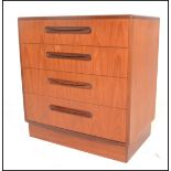 A 1970's G-Plan teak wood Kelso Pattern chest of drawers being raised on an inset plinth with