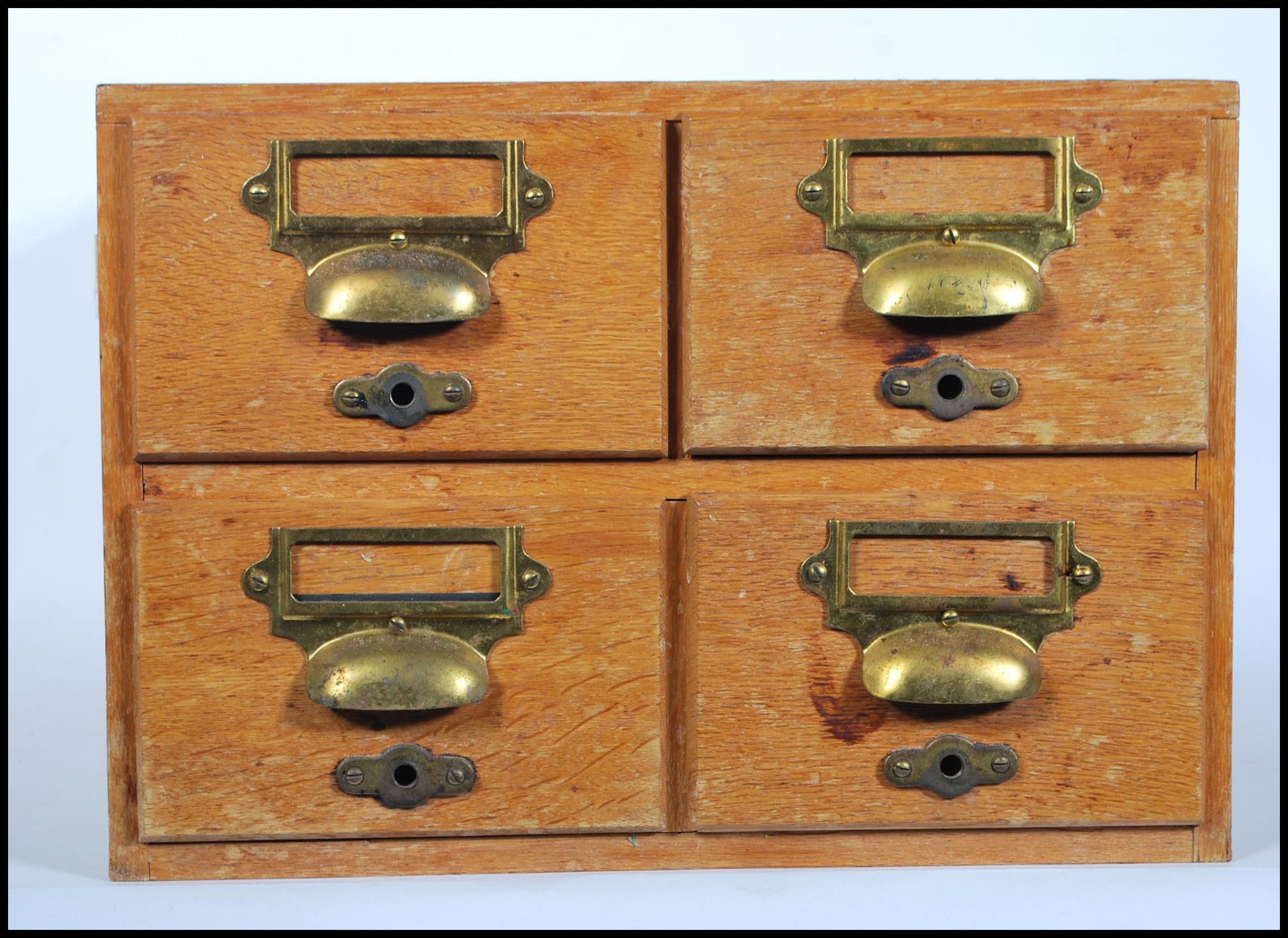 A retro mid 20th Century Industrial wooden 4 drawer table top filing cabinet index. Each drawer