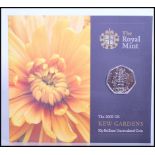 THE ROYAL MINT UNCIRCULATED 2009 KEW GARDENS 50p COIN, mounted to a presentation card