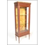 A 20th Century French mahogany display cabinet / vitrine in the manner of Vernis Martin. The cabinet