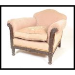 A 1920's Bergere armchair. Raised on carved legs w