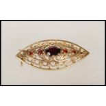 A 9ct gold vintage boat shaped brooch having pierc