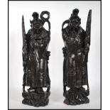 A pair of 20th century Chinese carved hardwood figures of Deity's / Immortals raised on a