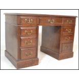 A Victorian mahogany twin pedestal office desk. Raised on plinth bases, each pedestal with a bank of