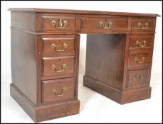 A Victorian mahogany twin pedestal office desk. Raised on plinth bases, each pedestal with a bank of