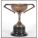 An early 20th Century silver hallmarked Art Deco trophy having triangular geometric handles.