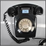 A vintage 1970's  local interest black wall mounting dial telephone model 741 GNA 72/1 being
