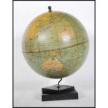 A vintage 1930's Art Deco desk top Philip's Challenge globe, the map depicting shipping routes and