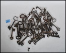 A collection of decorative antique keys of various sizes and forms.
