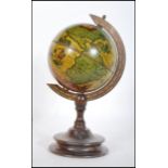 A 20th century desktop Georgian style terrestrial globe in the antique style raised on a stepped