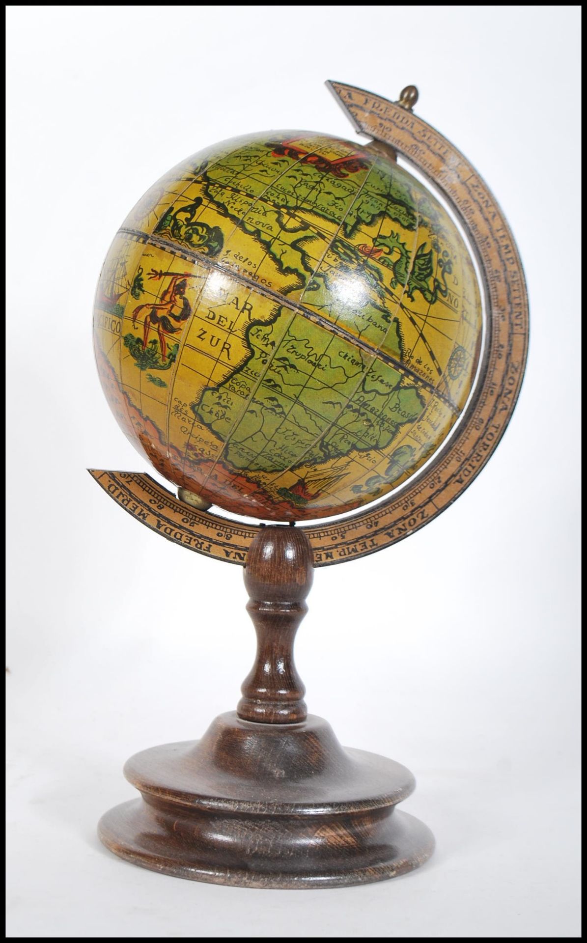 A 20th century desktop Georgian style terrestrial globe in the antique style raised on a stepped