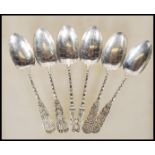 A set of six Chinese silver white metal teaspoons having leaf decorated bowls with bamboo stems.