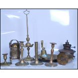 A collection of brass items dating from the 19th century onwards to include a brass mantel clock