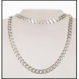 A hallmarked 925 silver heavy curb chain necklace and matching bracelet each fitted with a lobster