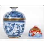 A Chinese hand painted blue and white crackle glazed lidded pot / cup and cover having brass rims