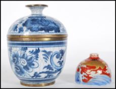 A Chinese hand painted blue and white crackle glazed lidded pot / cup and cover having brass rims