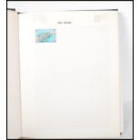 A 20th Century world stamp album containing stamps dating from the 19th Century to include