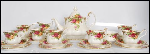 A vintage 20th Century Royal Albert bone China tea service for six in the Country Roses pattern
