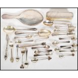 A collection of silver hallmarked flatware to include Georgian teaspoon, commemorative teaspoons,