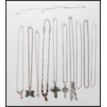 A group of stamped 925 silver pendant necklaces to include a celtic crucifix necklace set with a