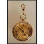 A mid 20th Century hallmarked 18ct gold pocket watch having a gilt dial with floral decoration and