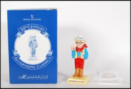 A Royal Doulton ceramic advertising figure for ' The Milkybar Kid , AC7, limited edition no. 523 /