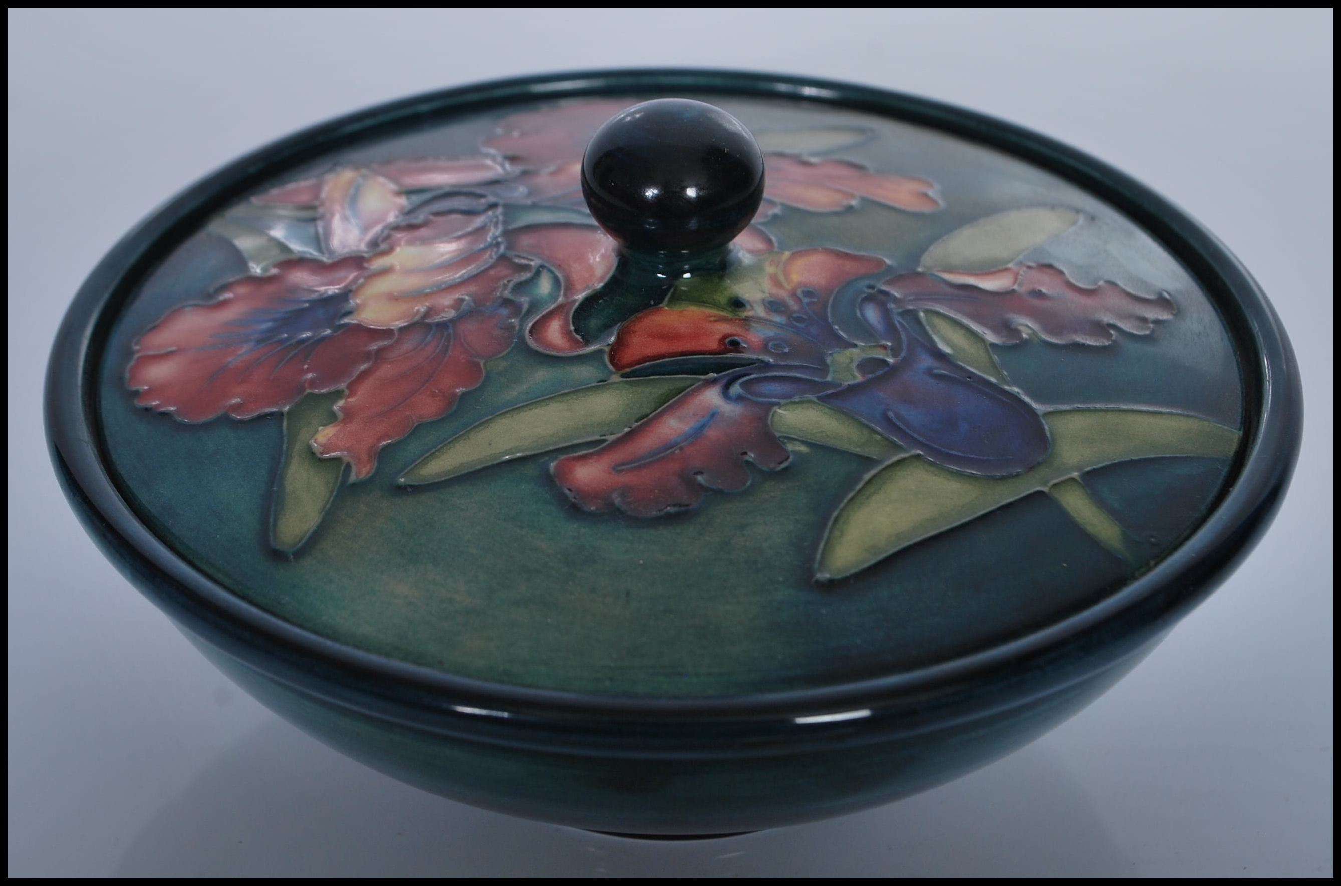 A 20th century Moorcroft blue and green ground  lidded circular dish having a floral ' poppy  ' - Image 2 of 6