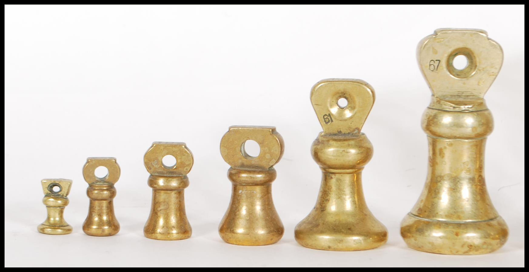 A selection of 20th century graduating brass bell weights having carrying handles atop, with the - Image 2 of 7