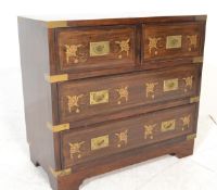 A 20th century antique style mahogany campaign chest of drawers. The chest with brass bindings and