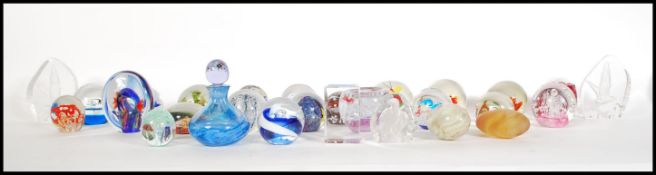 A good collection of 20th Century studio art glass paperweights to include various controlled bubble