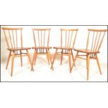 A set of four vintage retro 20th century Ercol beech and elm Windsor model 391 dining chairs