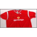 A Manchester United Football Shirt Signed By Arthur Albiston, Clayton Blackmore, Lee Martin, Sammy