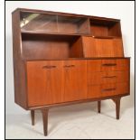 A stunning mid century teak wood Danish inspired mid top sideboard credenza. Three drawers to the
