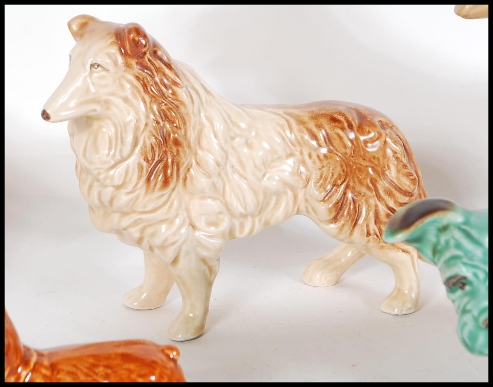 A collection of vintage 20th Century ceramic dog figurines by Sylvac to include a 1930's Terrier - Image 5 of 7