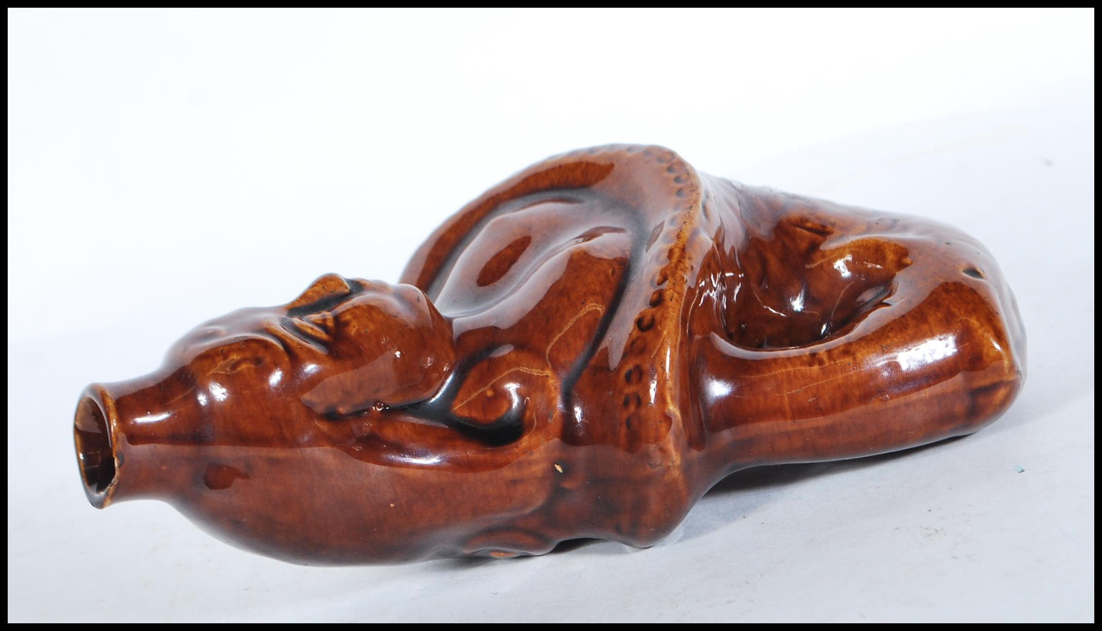 A mid 19th century treacle glaze gin flask in the form of a mermaid. Circa 1840, with waisted top - Image 3 of 6