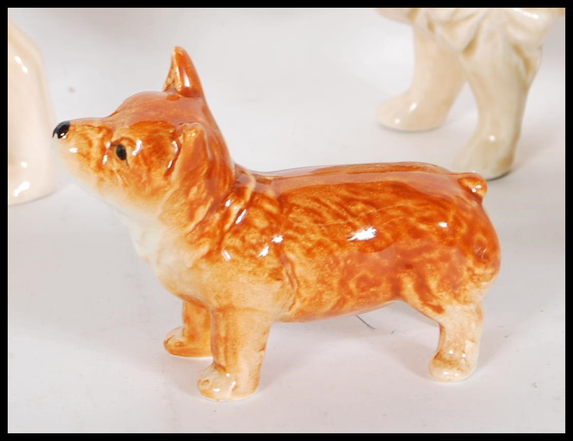 A collection of vintage 20th Century ceramic dog figurines by Sylvac to include a 1930's Terrier - Image 4 of 7