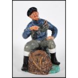 A Royal Doulton ceramic figurine entitled The Lobster Man HN2317 modelled on a naturalistic base