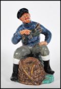 A Royal Doulton ceramic figurine entitled The Lobster Man HN2317 modelled on a naturalistic base